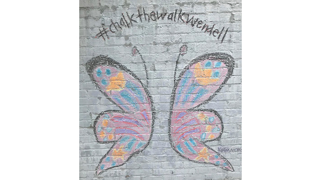 To help cheer up small businesses, Michele and other volunteers drew chalk drawings in front of small businesses to help to brighten their day.